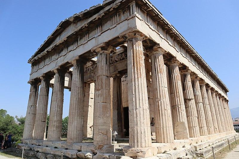 An open temple building consisting of numerous Doric colonnades supporting a massive roof structure.