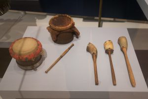 Two drums and three rattles