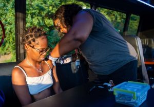 Medical care given to woman living in homeless encampment.